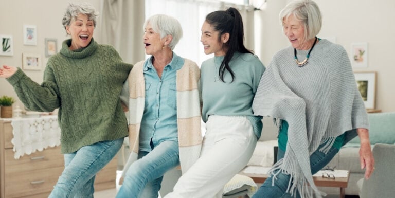 Elderly Women Dancing Joyfully Together at Assisted Living Facility